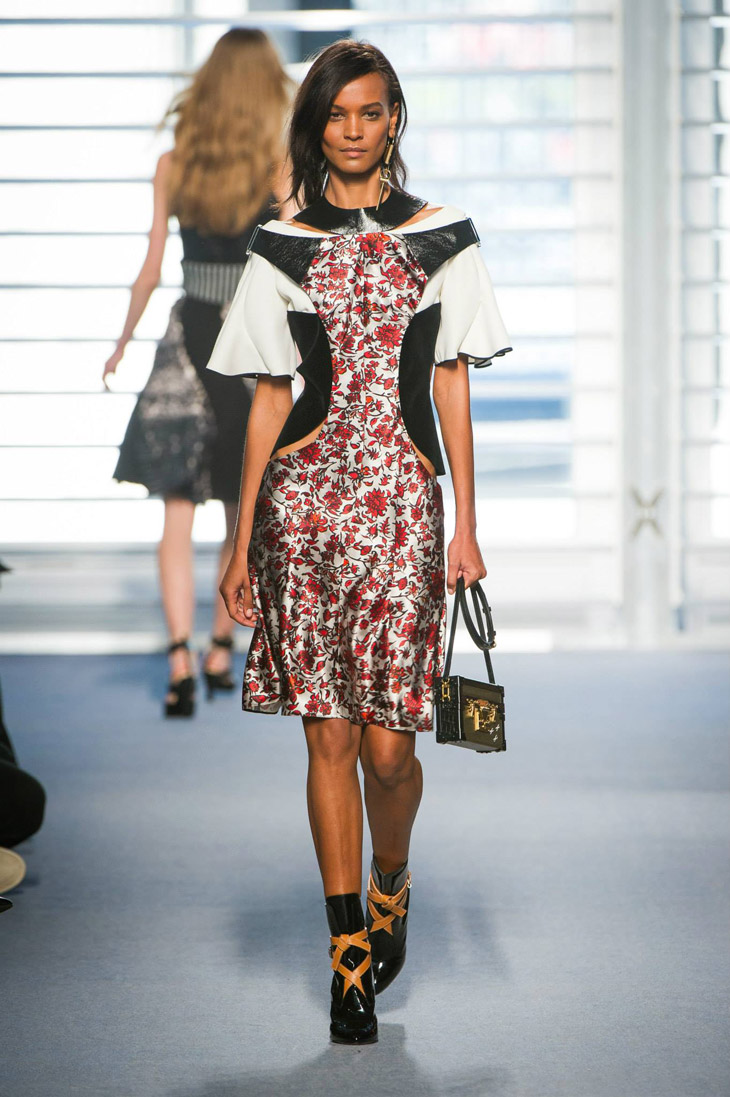 A model displays a creation by designer Nicolas Ghesquiere for Louis Vuitton  Fall-Winter 2014/2015 Ready-To-Wear collection show held at Cour Carree du  Louvre in Paris, France, on March 05, 2014. Photo by