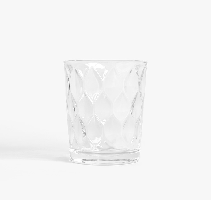 Tumbler Glass with ornamented design surface -