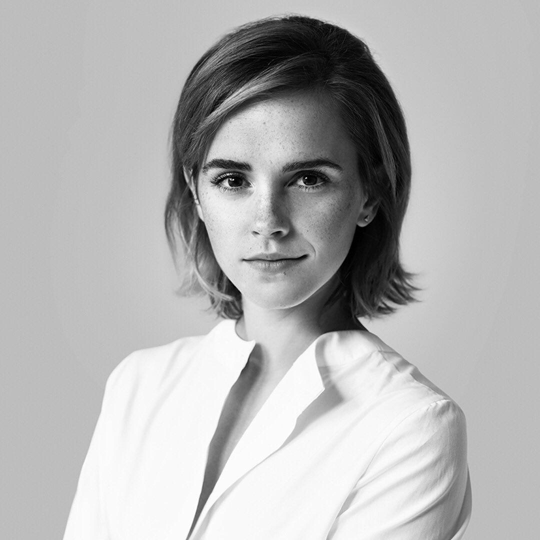 Emma Watson rocks a white sweatshirt and black leggings while