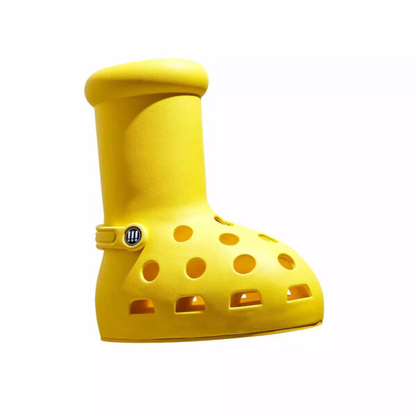 Paris Hilton Models MSCHF x Crocs Big Yellow Boots